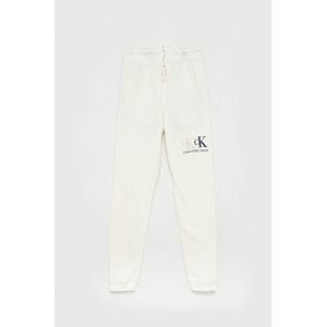 Dětské kalhoty Calvin Klein Jeans bílá barva, s aplikací