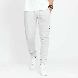 Tepláky TOMMY JEANS M Badge Sweatpants melange šedé