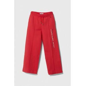 Dětské bavlněné tepláky Calvin Klein Jeans červená barva, s potiskem