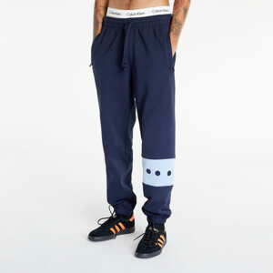 Tepláky adidas Originals RIFTA City Boy Sweatpant Legend Ink